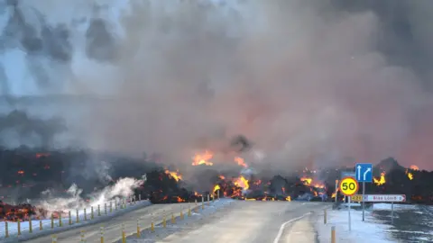 Reuters Lava crossing the road