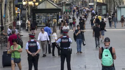 EPA Police standing at Las Ramblas in Barcelona