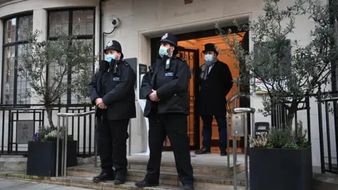 EPA Police officers guard the entrance to the King Edward VII Hospital where the Duke of Edinburgh has been admitted as a precaution