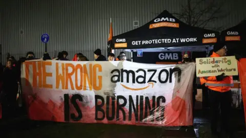 Reuters Union members at a rally outside Amazon in Coventry