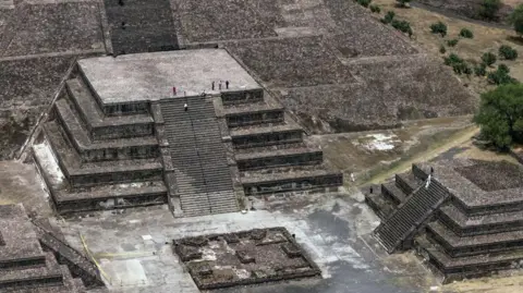 Franyeli García/EPA/Shutterstock An aerial view shows investigators patrolling the area of the Pyramid of the Moon in the municipality of San Juan Teotihuacan in the State of Mexico, Mexico, 21 April 2026.