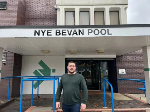 James Upjohn, a former independent West Lancashire councillor, stands outside Nye Bevan swimming baths