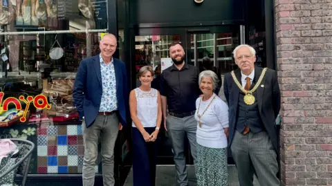 Lunya Image shows, from left to right, Peter Kinsella, his wife Elaine, Lunya operations manager Tom Cavanagh, Lord Mayor's Consort Erica Kemp and Lord Mayor of Liverpool Richard Kemp standing outside the Lunya restaurant in Liverpool