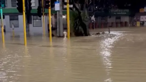 Reuters A flooded road in Wellington, New Zealand