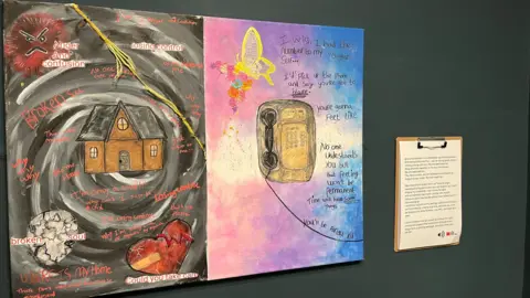 Federica Bedendo/BBC The untitled artwork by the unnamed 21-year-old care leaver. The collage piece is split in two, a dark side featuring a house, a broken skull, a heart and words like anger and broken soul. The other side featured a phone against a colourful pink and blue background with a butterfly and flowers. 