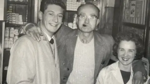 Ray McConaghy A black and white photo of Sadie and two colleagues from work.