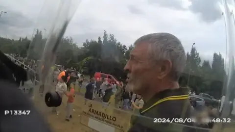 South Yorkshire Police A man behind a riot shield