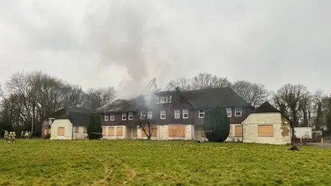 Smoke coming out of a derelict building belonging to St Piers School in Lingfield.