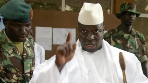 AFP Yahya Jammeh, when president of The Gambia, shows his fingers with ink after casting his vote during the presidential elections 22 September 2006