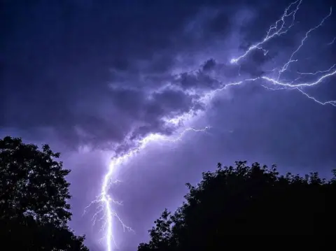 Peter Barrett /  Weather Watchers Lightning lights up the night sky in Hornchurch, Greater London