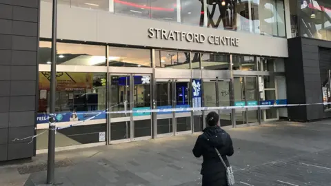 PA Media Police tape outside the Straford Centre in in Stratford, east London