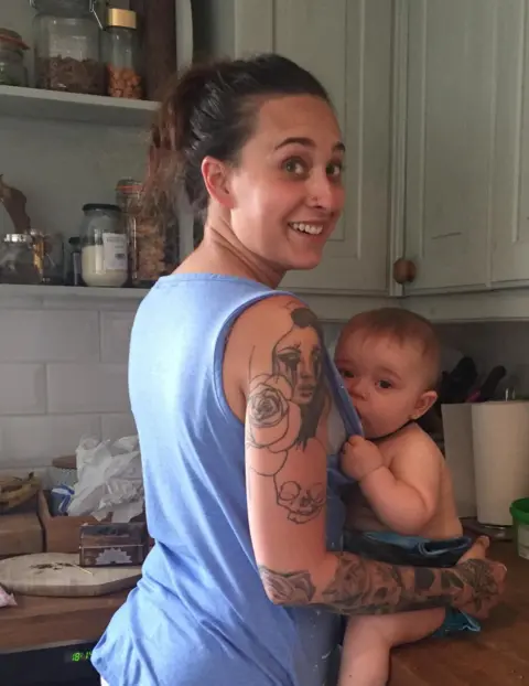 Family photo Harriet breastfeeding her baby