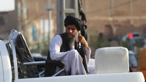 Getty Images Taliban patrolling in Herat, Afghanistan, 18 August