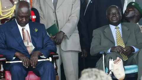 Getty Images Outgoing Kenyan President Daniel arap Moi (L) sits next to President-elect Mwai Kibaki during a swearing-in ceremony December 30, 2002 in Nairobi, Kenya