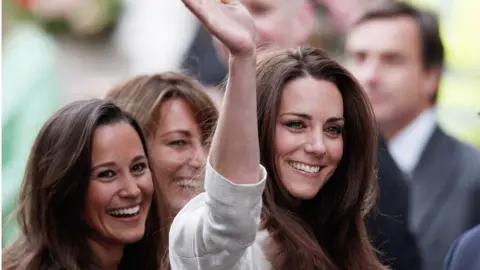 Getty Images Catherine pictured with her sister Pippa and mother Carole