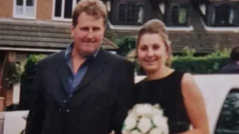 Family handout An image of James Messham alongside his eldest daughter Charmaine Messham. They are both dressed smartly.