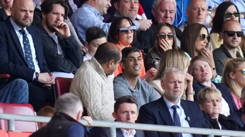 Reuters Rishi Sunak surrounded by people in the stands of St Mary's