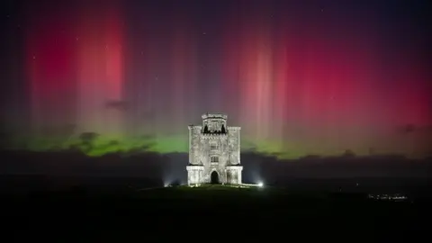 Mathew Browne Northern Lights above Paxton's Tower in Carmarthenshire