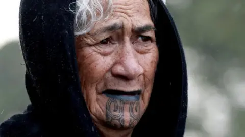 AUCKLAND, NEW ZEALAND - AUGUST 03: A Maori woman looks on during a powhiri (Māori welcoming ceremony) to welcome Kiingi Tūheitia to Ihumātao on August 03, 2019 in Auckland, New Zealand.