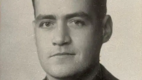Geoffrey Doyle wearing his uniform and looking straight at the camera. 