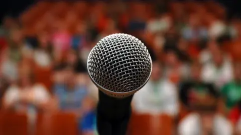 Getty Images Microphone and crowd