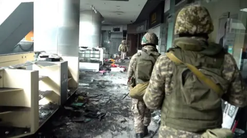 Kazakh soldiers at a mall in Almaty