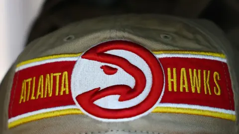 A cap featuring the logo of the Atlanta Hawks