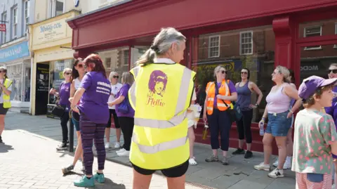 Hollie Gazzard Trust People walking through Gloucester city centre in memory of Hollie Gazzard