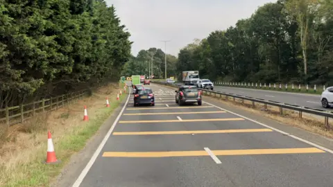 Cars heading towards and away from Brundall roundabout