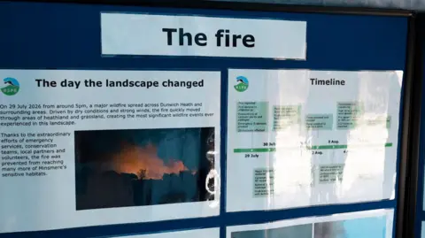 John Fairhall/BBC Poster on a board indicating fire at RSPB Minsmere. One has a timeline of the events.