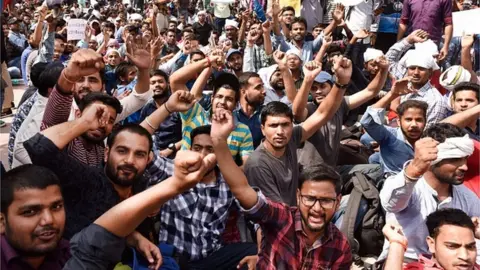 Getty Images Hundreds of aspirants continued their protest outside the Staff Selection Commissions (SSC) office at CGO Complex demanding that Central Bureau of Investigation conduct an investigation into the alleged paper leak and mass cheating in the Combined Graduate-Level (CGL) Tier II examination, on March 3, 2018 in New Delhi, India