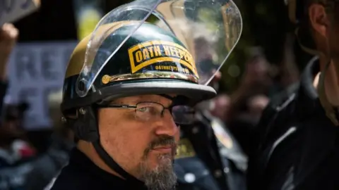 Getty Images Oath Keepers founder Stewart Rhodes at a Trump rally in 2017