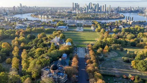Getty Images An aerial photo of Greenwich Park, with the skyscrapers of Canary Wharf and surrounding areas on the river in the background. 