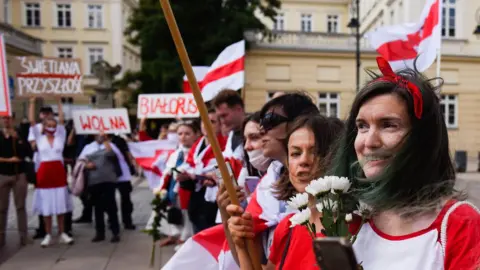 Getty Images The Belarusian minority living in Poland wait for the exiled Belarus opposition leader