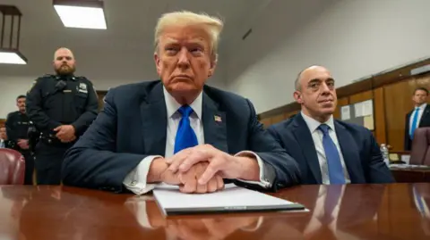 Getty Images Donald Trump waits in court during his Manhattan criminal trial in May.