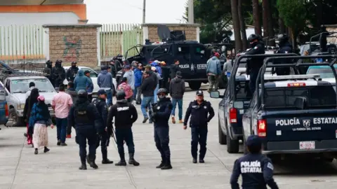 EPA Members of the State Police stand guard in the Texcapilla sector, in the town of Texcaltitlan, in the central State of Mexico, Mexico, 11 December 2023