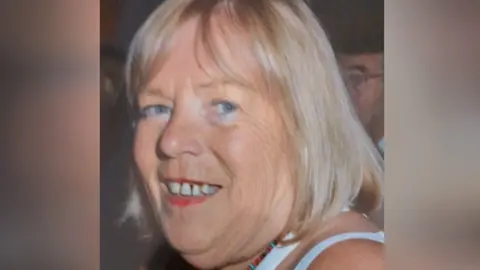 Humberside Police A head and shoulders picture of a woman. She has blonde shoulder-length hair and is looking towards the camera, smiling.
