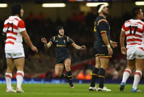 Getty Images Sam Davies kicks a drop goal
