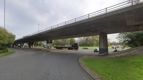 Google The Gateshead flyover from a roundabout. A lorry is just pulling out.   