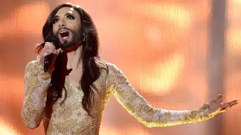 Getty Images / Jonathan Nackstrand Conchita Wurst representing Austria performs the song "Rise Like A Phoenix"