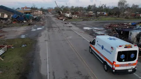 Reuters An ambulance arrives at Rolling Fork, Mississippi, which was devastated by a tornado, 25 March