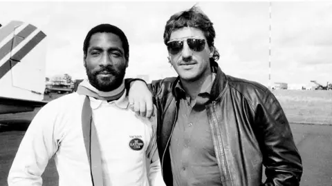 Somerset County Cricket Club Two men pictured on the cricketfield