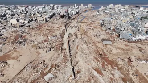 MARWAN ALFAITURI via REUTERS A view shows the damaged areas, in the aftermath of the floods in Derna, Libya, September 13, 2023, in this screen grab obtained from a social media video.