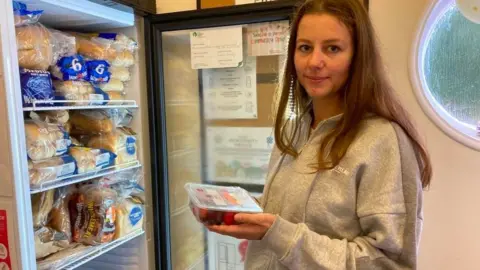 Woman at Purton fridge