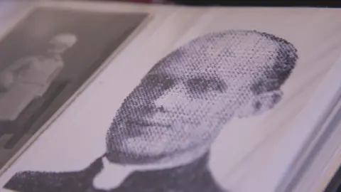 A picture of Father Joseph Brough in a photo album