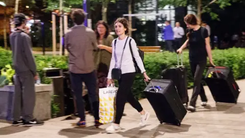 EPA People with luggage