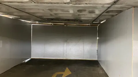 Car park blocked off with metal sheeting