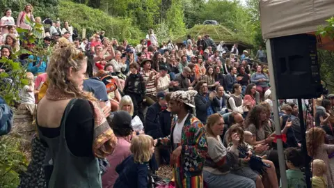 SWCF Hundreds of people are seen packed into St Werburgh's City Farm in Bristol during an open day. Many of them are families with children