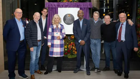 Carl Sukonik The former Piccadilly presenters stand in front of the unveiled plaque to commemorate their station at City Tower.