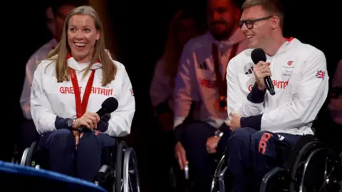 Getty Images for The National Lottery Hannah Cockroft (left) and Nathan Maguire smiling astatine  the event